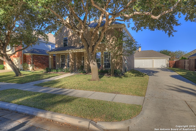 view of front of house with a garage and a front lawn