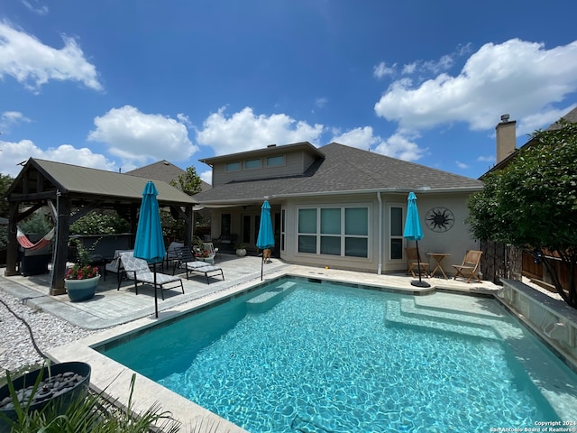 view of pool with a gazebo and a patio