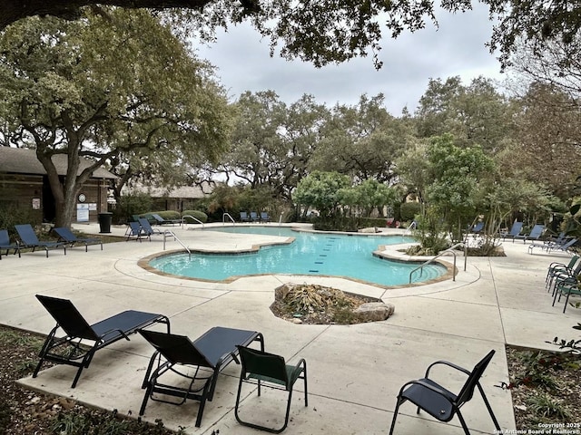 view of pool featuring a patio