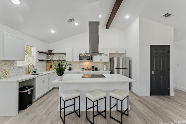 kitchen with a center island, sink, light hardwood / wood-style flooring, appliances with stainless steel finishes, and island range hood