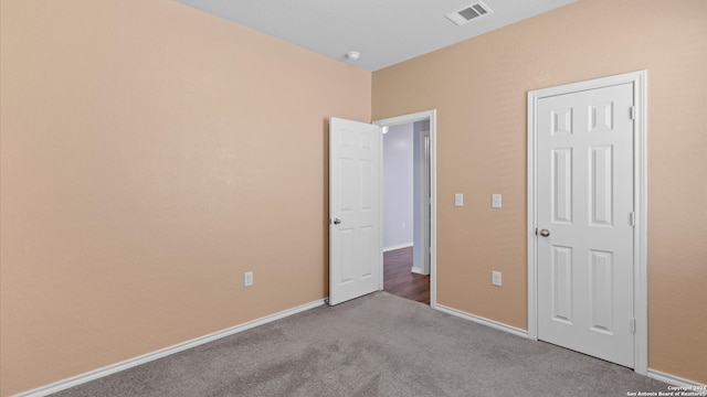 unfurnished bedroom with carpet floors