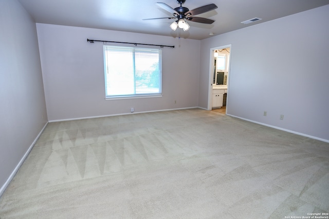 carpeted empty room with ceiling fan