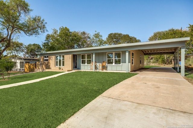 single story home with a carport and a front lawn