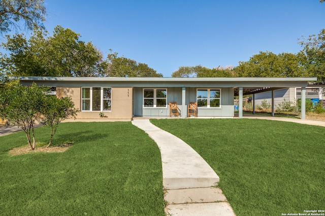 ranch-style house with a front lawn and a carport