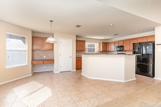 kitchen featuring a kitchen island, backsplash, pendant lighting, light tile patterned flooring, and black appliances