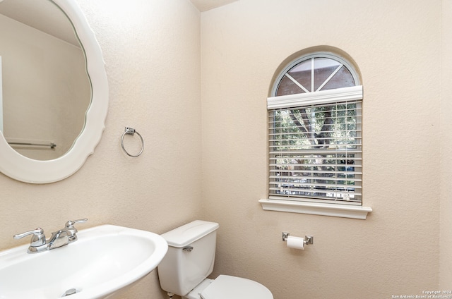 bathroom with sink and toilet