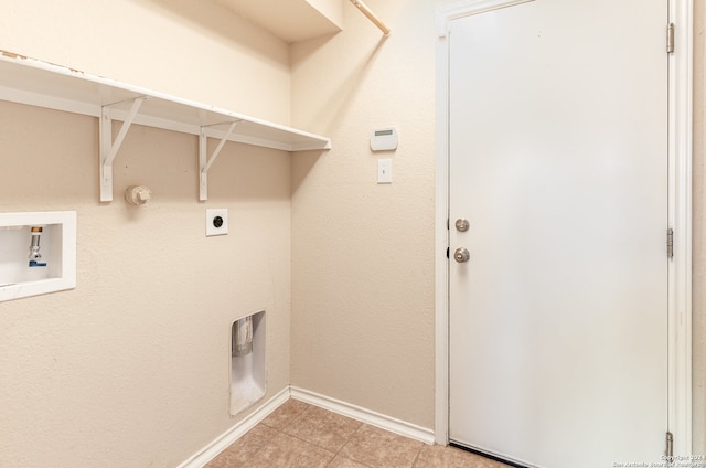 washroom featuring hookup for a gas dryer, hookup for a washing machine, light tile patterned floors, and hookup for an electric dryer