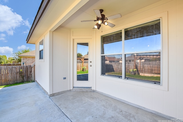 property entrance with ceiling fan and a patio area