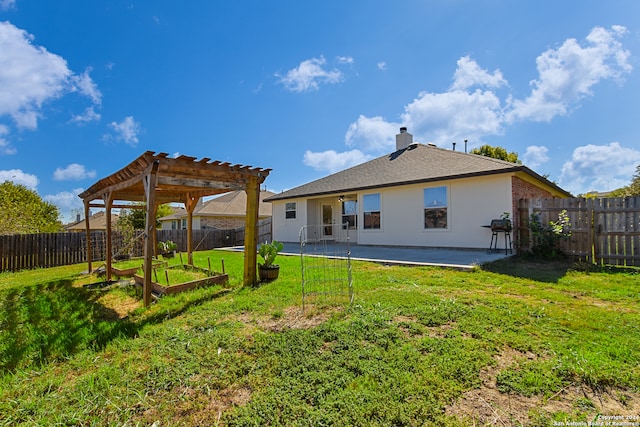 back of house with a yard, a pergola, and a patio