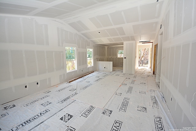 empty room with lofted ceiling