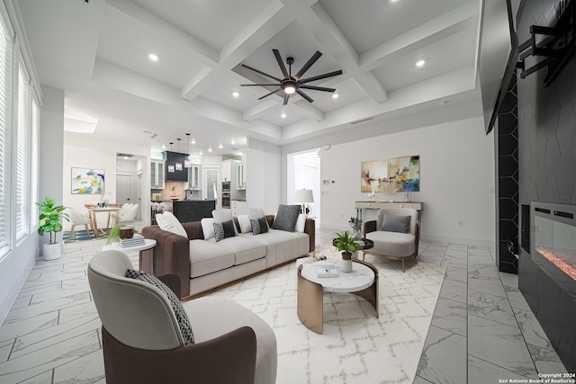 living room featuring beam ceiling, ceiling fan, and coffered ceiling