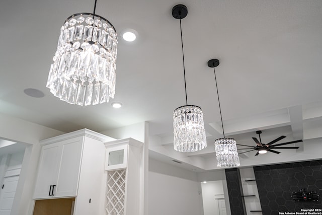 details featuring white cabinets and ceiling fan