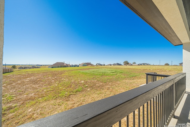 view of yard with a rural view