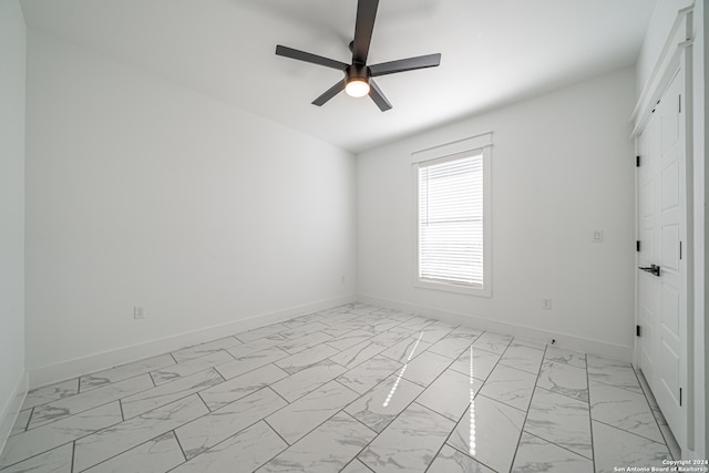 unfurnished room with ceiling fan