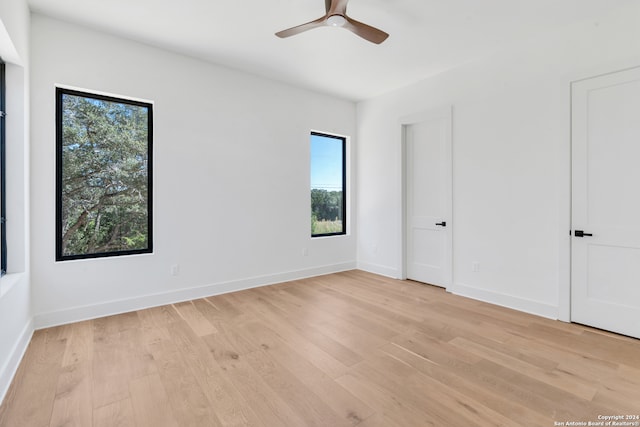 unfurnished room featuring ceiling fan and light hardwood / wood-style flooring