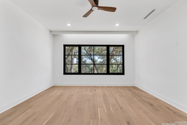 unfurnished room featuring ceiling fan and light hardwood / wood-style floors