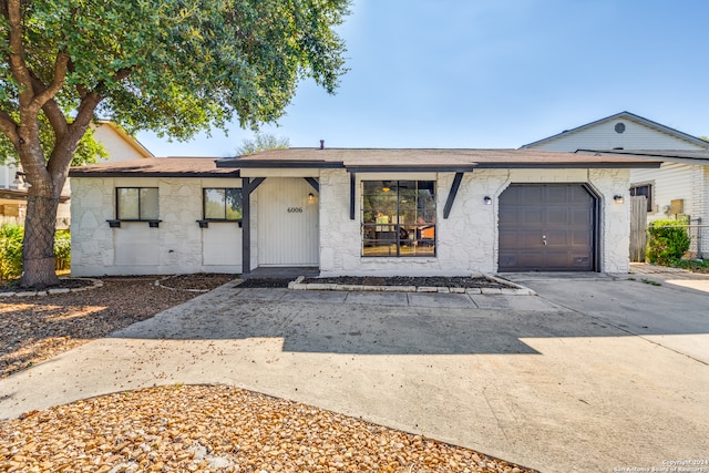 ranch-style house featuring a garage