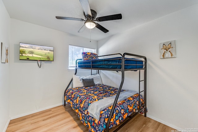 bedroom featuring ceiling fan and hardwood / wood-style flooring