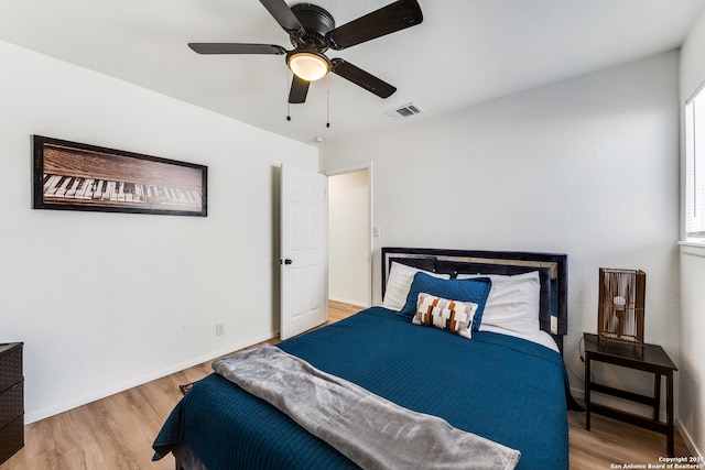 bedroom featuring light wood-type flooring and ceiling fan