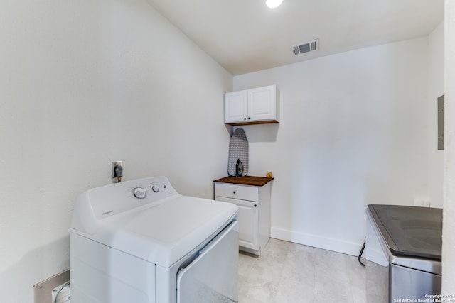 laundry room featuring cabinets and washing machine and clothes dryer