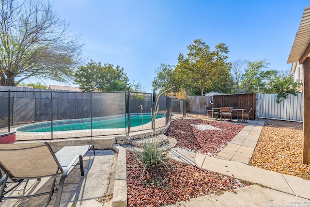 view of swimming pool featuring a patio