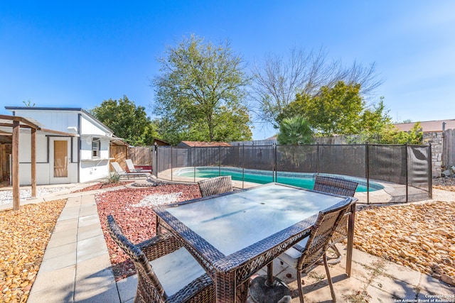 view of patio featuring a fenced in pool