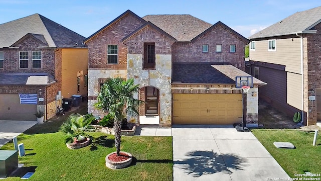 view of front of house featuring a garage and a front lawn