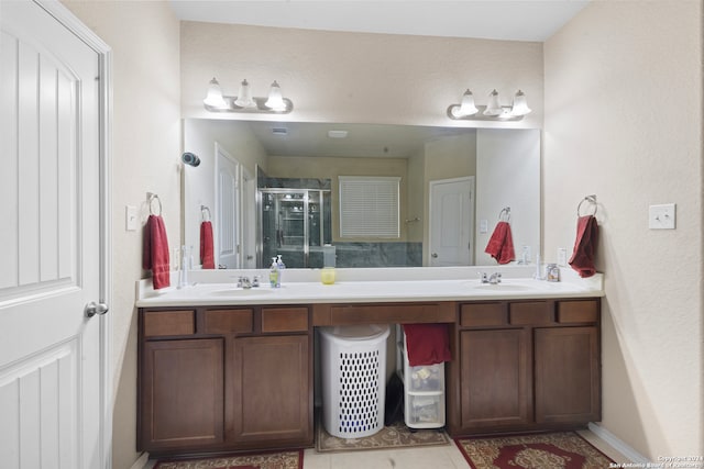 bathroom featuring vanity, tile patterned floors, and a shower with shower door