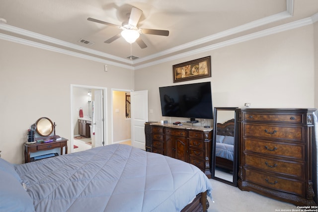 bedroom featuring ensuite bath, ceiling fan, light carpet, and ornamental molding