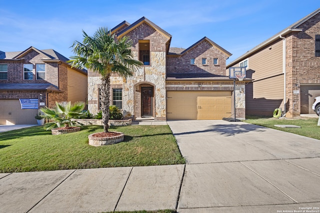 view of front of house with a front yard and a garage