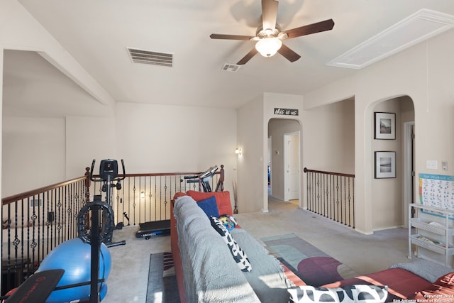 carpeted living room with ceiling fan