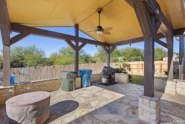 view of patio with a gazebo, area for grilling, and ceiling fan