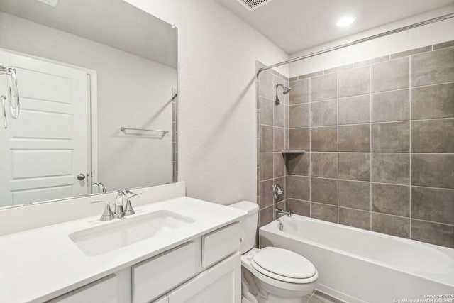 full bathroom featuring visible vents, toilet, vanity, and  shower combination