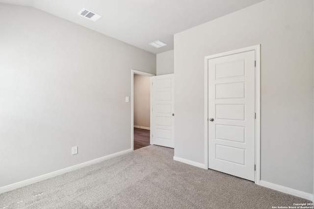 unfurnished bedroom featuring visible vents, baseboards, and carpet flooring