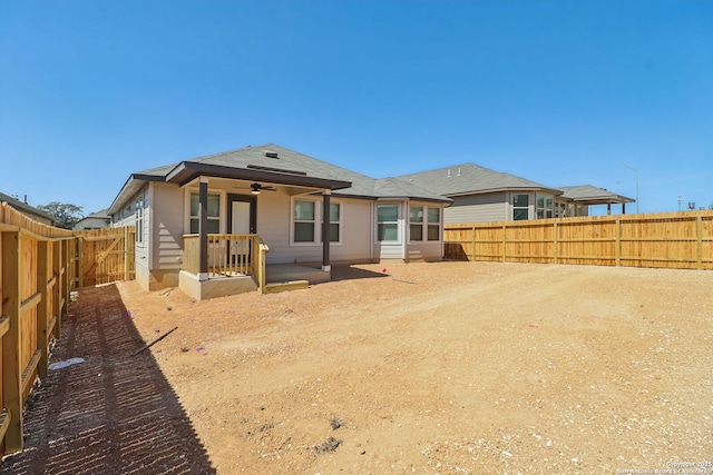 rear view of property with a patio area, ceiling fan, and a fenced backyard