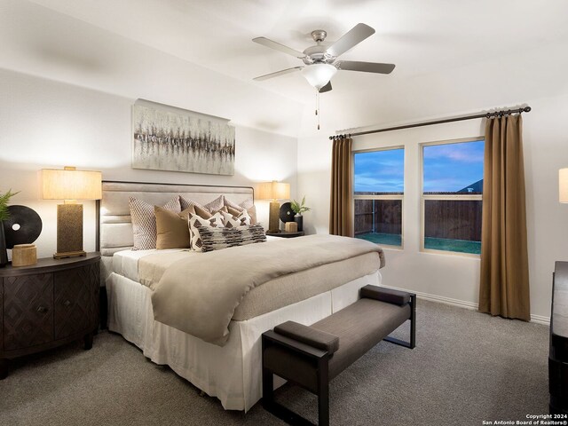 bedroom featuring ceiling fan and carpet