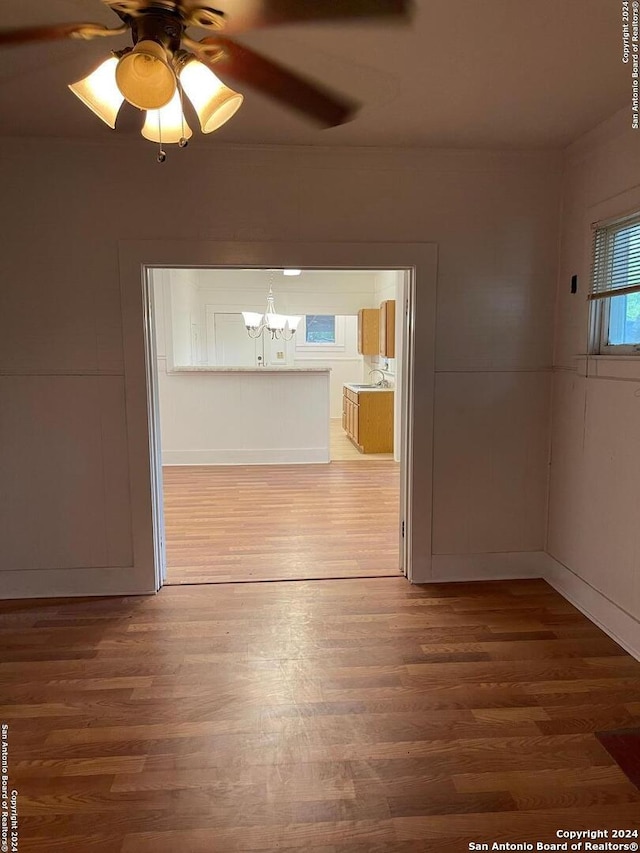 spare room featuring ceiling fan and wood-type flooring