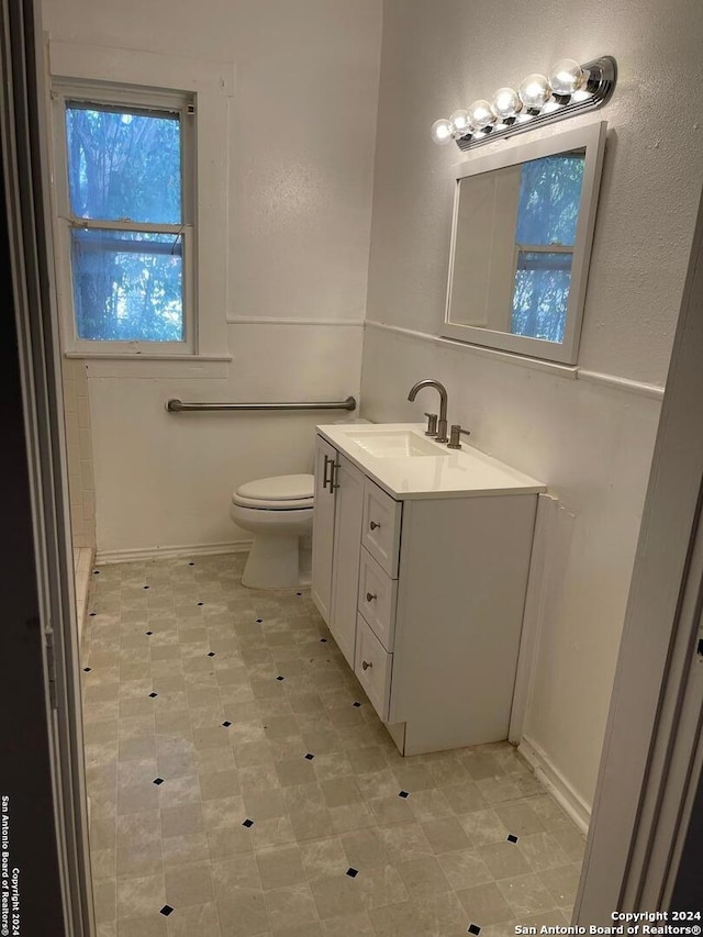 bathroom with vanity and toilet