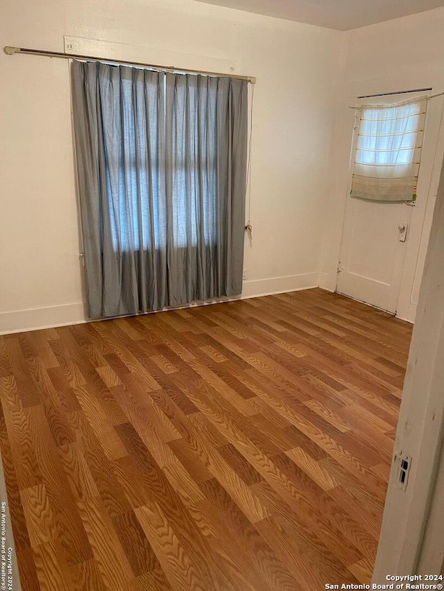 empty room with light wood-type flooring