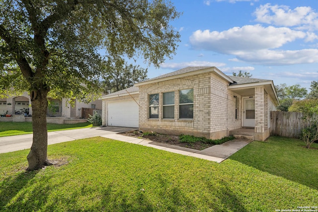 ranch-style home featuring a front yard and a garage