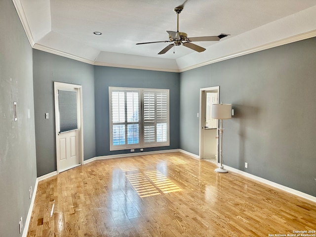 unfurnished room with ceiling fan, light wood-type flooring, lofted ceiling, and ornamental molding