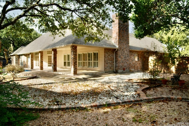 rear view of house featuring a patio area