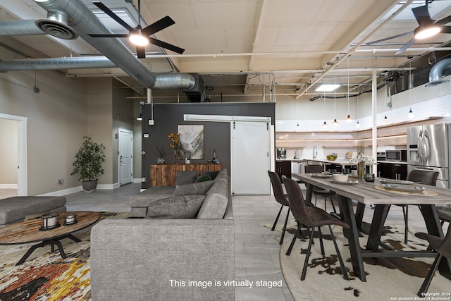 dining area with a towering ceiling