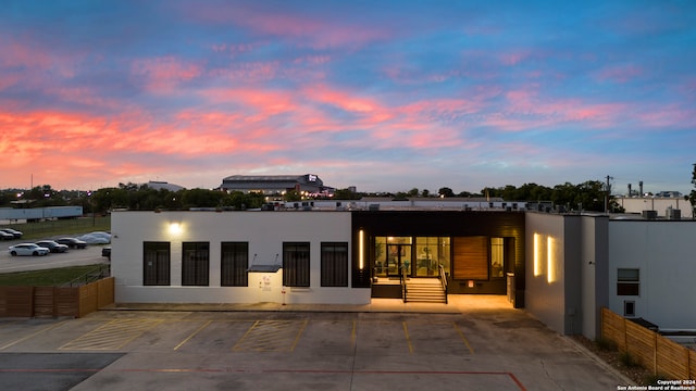 view of back house at dusk