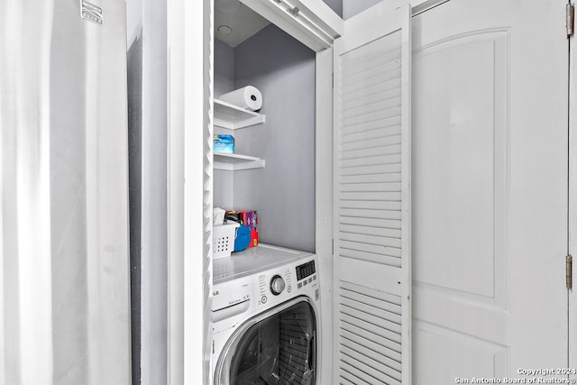 laundry area with washer / dryer