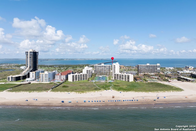 bird's eye view featuring a view of the beach and a water view