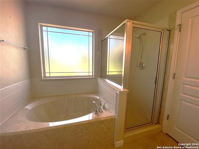 bathroom featuring tile patterned floors and plus walk in shower