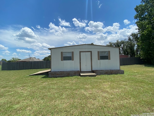 view of outdoor structure with a lawn