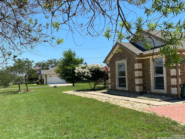 view of yard with a garage