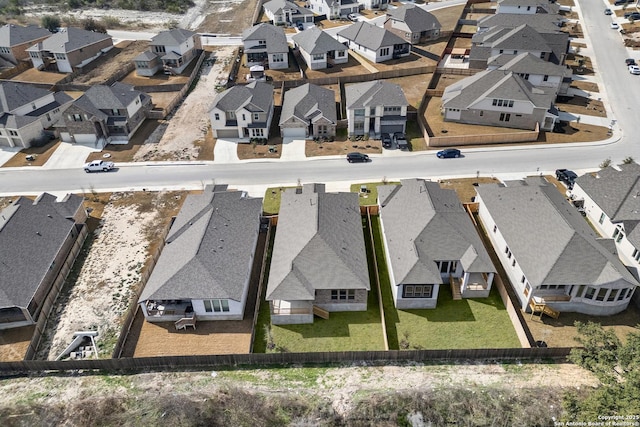 birds eye view of property with a residential view